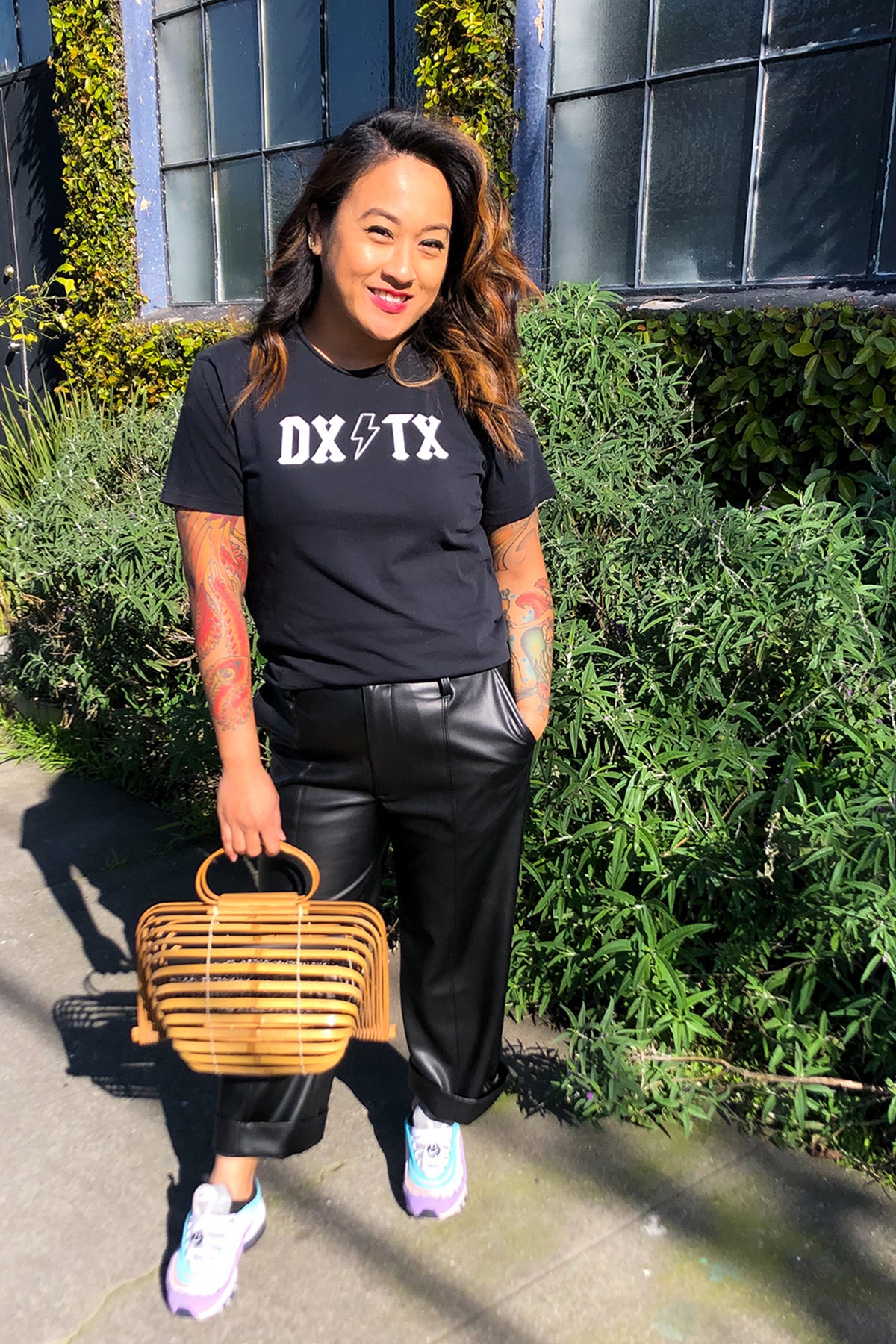 Person outside wearing the DX/TX t-shirt